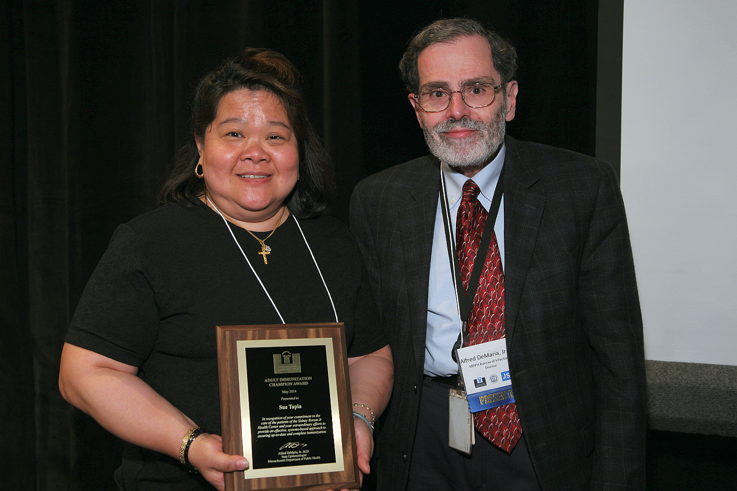 Sue Tapia, LPN, Sidney Borum Jr Health Center receiving her award from Alfred DeMaria, Jr, MD.